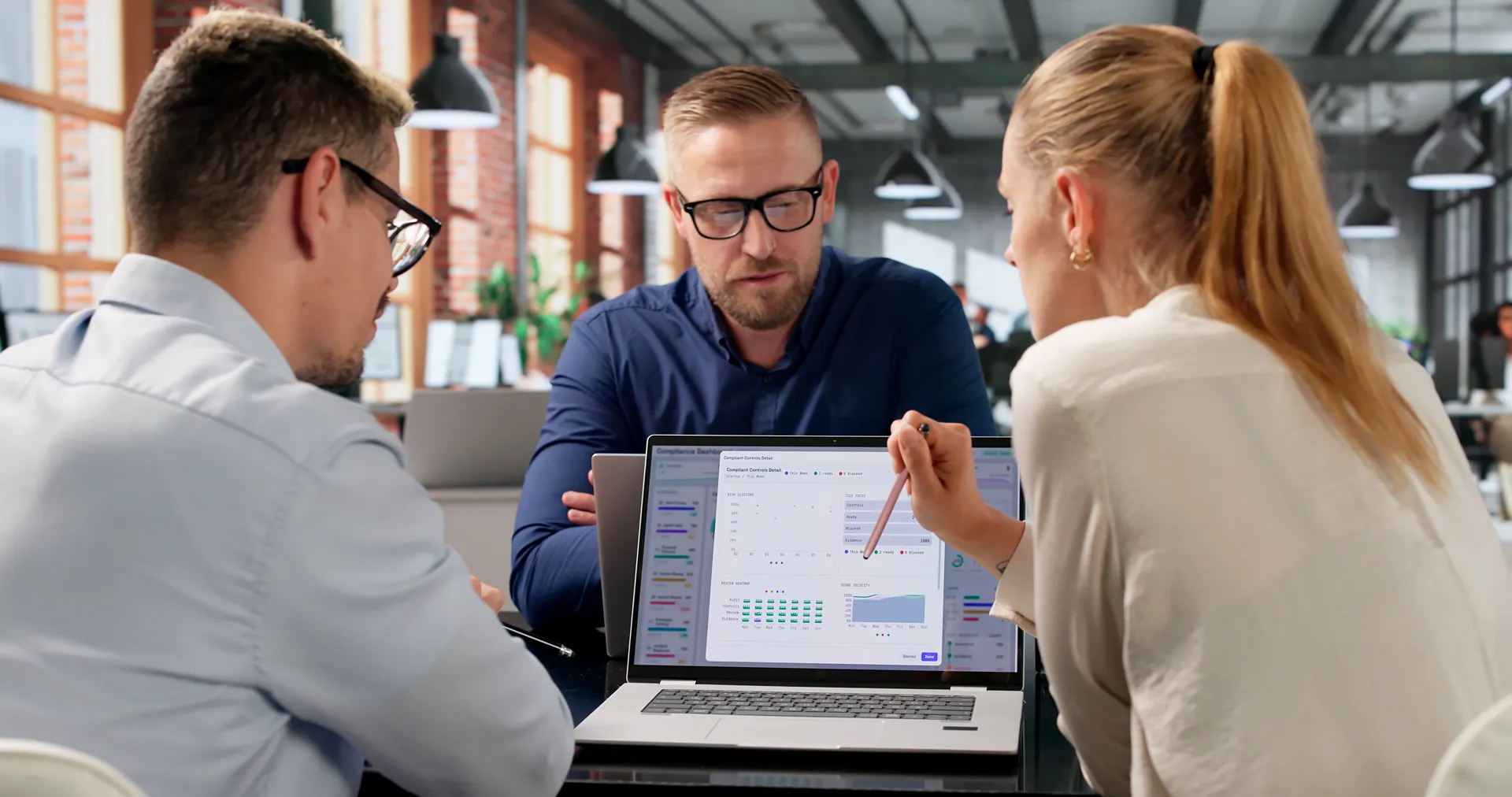 Team Reviewing Compliance Dashboard
